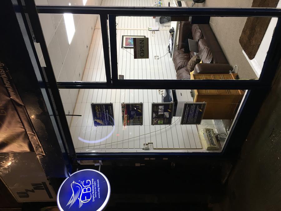 The first Hawkish Group office on the high street at night